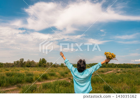 Woman with arms outstretched enjoying nature and freedom Woman with arms outstretched enjoying nature and freedom 143035162