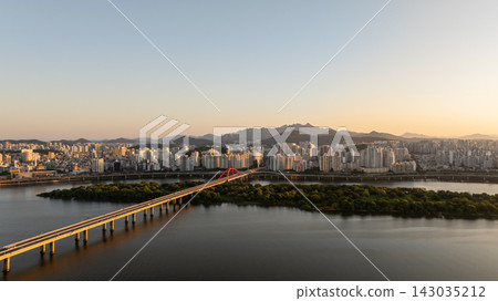 Aerial view of morning sunrise over Hangang River and Yeouido skyline in Seoul Aerial view of morning sunrise over Hangang River and Yeouido skyline in Seoul 143035212