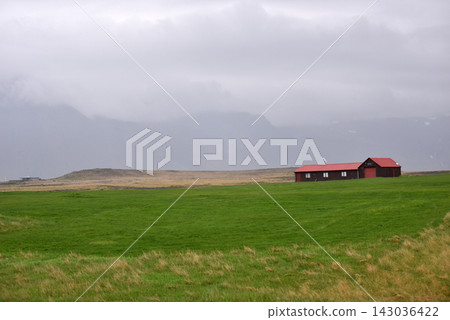 Icelandic farmhouses under misty mountains Icelandic farmhouses under misty mountains 143036422