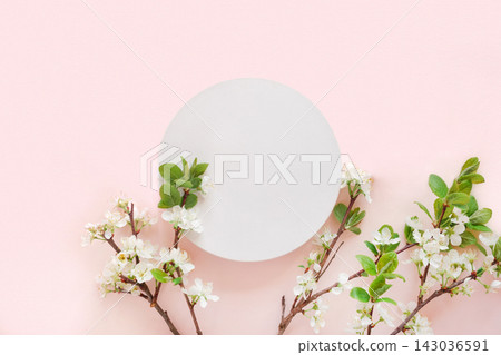 Round Podium with flowering apple branches for product presentation. Abstract minimal geometrical form on pink background. One Showcase, white flowers, soft shadow. Scene, display. Top view, Flat lay Round Podium with flowering apple branches for product presentation. Abstract minimal geometrical form on pink background. One Showcase, white flowers, soft shadow. Scene, display. Top view, Flat lay 143036591