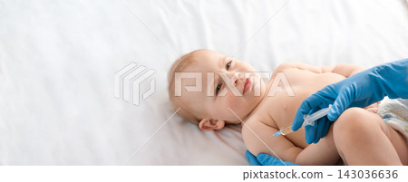 Doctor vaccinating baby in clinic. Little baby get an injection. Pediatrician vaccinating newborn baby. Vaccine for infant child. Child's Immunization, Children's Vaccination, Health concept Doctor vaccinating baby in clinic. Little baby get an injection. Pediatrician vaccinating newborn baby. Vaccine for infant child. Child's Immunization, Children's Vaccination, Health concept 143036636