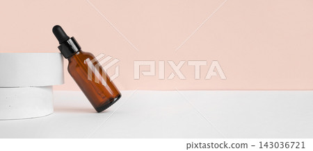 Amber glass dropper cosmetic bottle, white podium. Natural skin care SPA beauty product design. Mineral organic oil on beige background. Mock-Up. Oily pipette. Face and body treatment. Front view Amber glass dropper cosmetic bottle, white podium. Natural skin care SPA beauty product design. Mineral organic oil on beige background. Mock-Up. Oily pipette. Face and body treatment. Front view 143036721