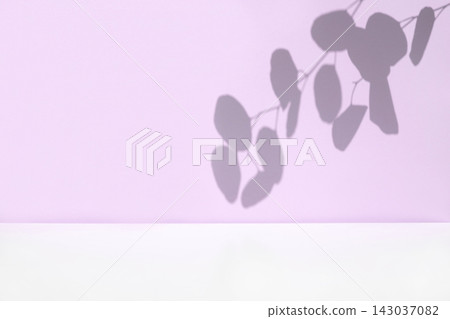 Plant shadows on violet color wall. Leaves shadow background. Branches, flowers and foliage on pastel studio background. Product presentation, Minimal mock up for advertising. Trendy Overlay effect Plant shadows on violet color wall. Leaves shadow background. Branches, flowers and foliage on pastel studio background. Product presentation, Minimal mock up for advertising. Trendy Overlay effect 143037082