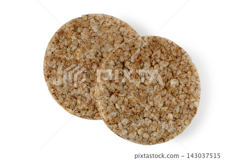 Two round whole grain rice cakes on a white background Two round whole grain rice cakes on a white background 143037515