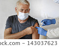 Doctor Vaccinating Senior Man In Clinic. Older People Vaccination. Doctor Giving Monkeypox or COVID Vaccine Injection to Mature Man In Face Mask. Protection of Elderly Patient. Old Man in Hospital 143037623