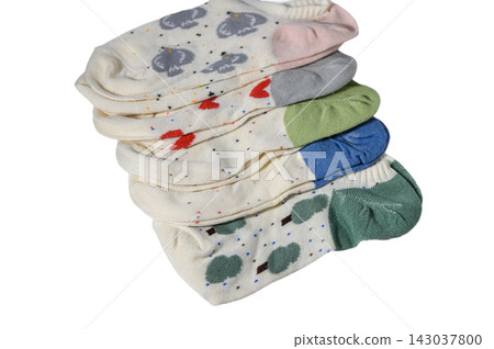 Stack of folded cute patterned ankle socks with various designs Stack of folded cute patterned ankle socks with various designs 143037800