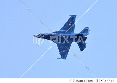 A flight scene of an F-2 fighter jet, showcasing its striking blue camouflage. A flight scene of an F-2 fighter jet, showcasing its striking blue camouflage. 143037842