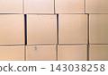 Full frame background texture of stacked brown cardboard boxes 143038258