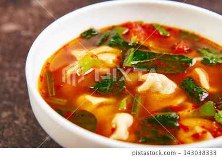 Spicy Dumpling Soup with Vegetables and Greens Spicy Dumpling Soup with Vegetables and Greens 143038333