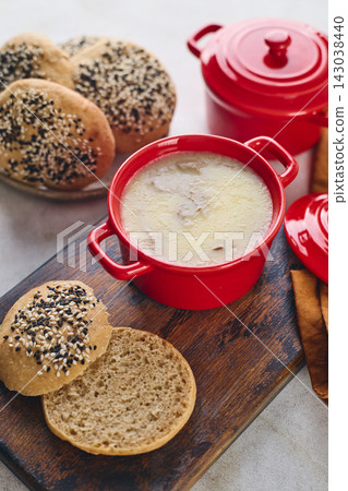 Gourmet Liver Pate Appetizer with Sesame Seed Bagels and and Fresh Pea Shoots on Rustic Wooden Board Gourmet Liver Pate Appetizer with Sesame Seed Bagels and and Fresh Pea Shoots on Rustic Wooden Board 143038440