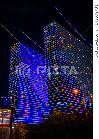 Modern buildings illuminated at night along the Batumi Boulevard seaside promenade on the Black Sea coast in Batumi, Georgia Modern buildings illuminated at night along the Batumi Boulevard seaside promenade on the Black Sea coast in Batumi, Georgia 143038731