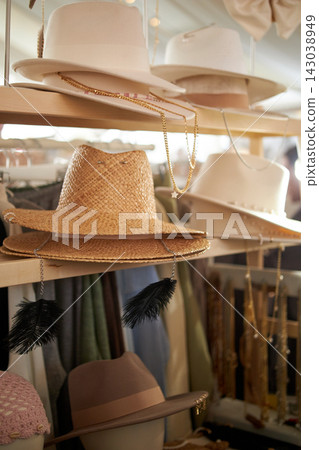 Stylish hats made of felt, fabric and straw are displayed at street market. Stylish hats made of felt, fabric and straw are displayed at street market. 143038949