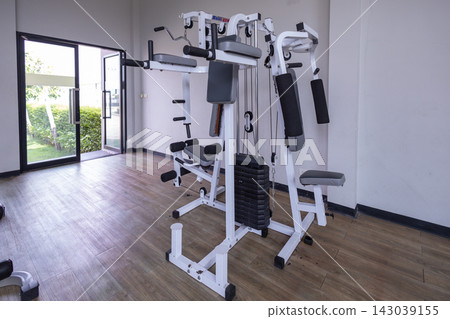Spacious and Bright Modern Fitness Center Interior with Equipment Spacious and Bright Modern Fitness Center Interior with Equipment 143039155