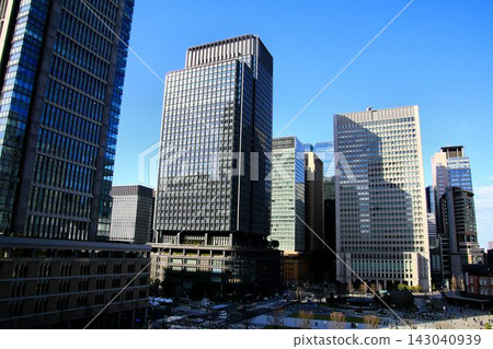 Bathed in the spring sunshine in front of the central station... A business building near Tokyo Station. Bathed in the spring sunshine in front of the central station... A business building near Tokyo Station. 143040939
