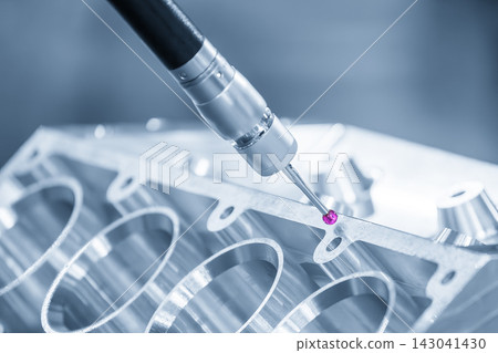 High-tech quality control: CMM machine measuring an aluminum V8 engine block with touching probe in blue lighting High-tech quality control: CMM machine measuring an aluminum V8 engine block with touching probe in blue lighting 143041430