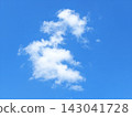 Playful Dragon-Shaped Clouds Frolicking in a Bright Blue Sky 143041728