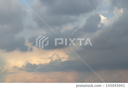A magnificent atmospheric study capturing the soft transition of twilight as gentle sunlight illuminates the lower sky. Heavy, slate-grey cumulus clouds drift gracefully across the upper canopy, A magnificent atmospheric study capturing the soft transition of twilight as gentle sunlight illuminates the lower sky. Heavy, slate-grey cumulus clouds drift gracefully across the upper canopy, 143043041