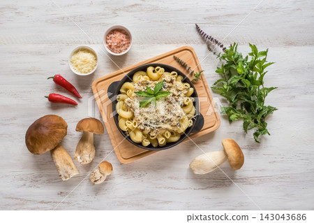 Gourmet Italian pasta with rich porcini mushroom sauce and cheese Gourmet Italian pasta with rich porcini mushroom sauce and cheese 143043686