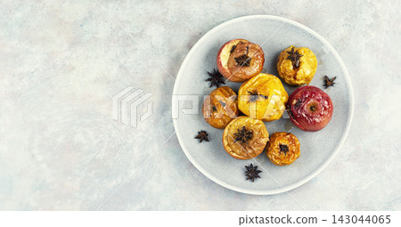 Traditional baked apples with aromatic spices, home cooking. Traditional baked apples with aromatic spices, home cooking. 143044065