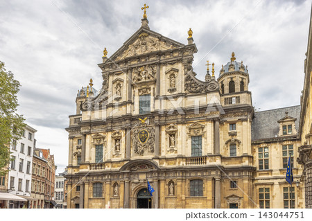 Antwerp town in Belgium, Europe. Grand Baroque Architectural Facade with Ornate Carvings Under a Dramatic Sky, Showcasing Historical European Design and Craftsmanship Antwerp town in Belgium, Europe. Grand Baroque Architectural Facade with Ornate Carvings Under a Dramatic Sky, Showcasing Historical European Design and Craftsmanship 143044751