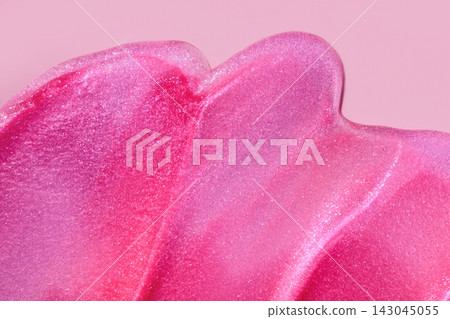 Pink glitter product creating textured shimmering background Pink glitter product creating textured shimmering background 143045055