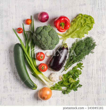 Fresh Assortment of Colorful Vegetables on Rustic White Background Fresh Assortment of Colorful Vegetables on Rustic White Background 143045181