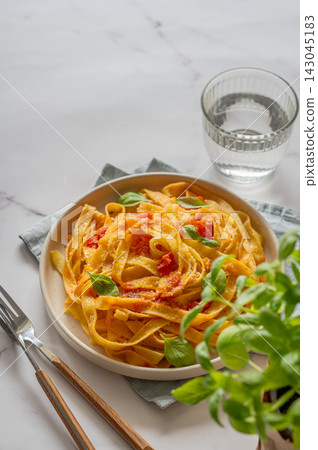 Homemade Tagliatelle Pasta with Tomato Sauce, Basil and Parmesan Homemade Tagliatelle Pasta with Tomato Sauce, Basil and Parmesan 143045183