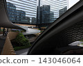 Curved lines and skyscrapers reflected in glass 143046064