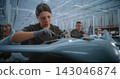 Female Mounting Electronic Boards Within Unmanned Aircraft Fuselage During Precision UAV Production 143046874