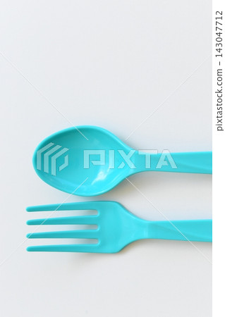 blue spoon and fork isolated on white background, plastic cutlery for picnic blue spoon and fork isolated on white background, plastic cutlery for picnic 143047712