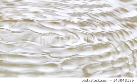 Ripples on the water's surface caused by raindrops; an abstract water texture. Ripples on the water's surface caused by raindrops; an abstract water texture. 143048159
