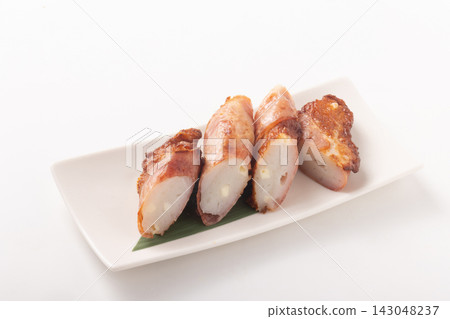 Cheese fish cake wrapped in bacon Cheese fish cake wrapped in bacon 143048237