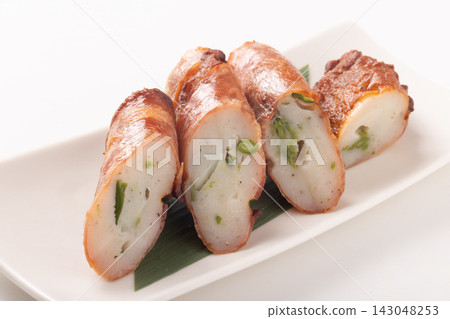 Asparagus fish cake wrapped in bacon Asparagus fish cake wrapped in bacon 143048253