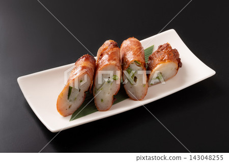 Asparagus fish cake wrapped in bacon Asparagus fish cake wrapped in bacon 143048255