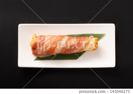 Fish cake wrapped in bacon Fish cake wrapped in bacon 143048273