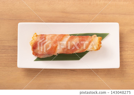 Fish cake wrapped in bacon Fish cake wrapped in bacon 143048275