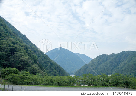 View from a parking lot nestled in the mountains View from a parking lot nestled in the mountains 143048475