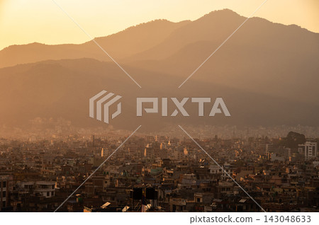 The cityscape of Kathmandu the capital city of Nepal during sunset. The city located in the bowl-shaped Kathmandu Valley of central Nepal. The cityscape of Kathmandu the capital city of Nepal during sunset. The city located in the bowl-shaped Kathmandu Valley of central Nepal. 143048633