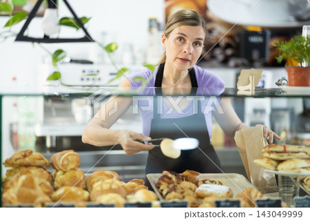 Female cafe employee offers to buy baked goods 143049999