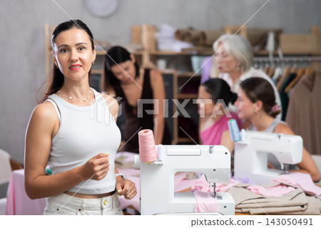 Adult woman at sewing master class Adult woman at sewing master class 143050491