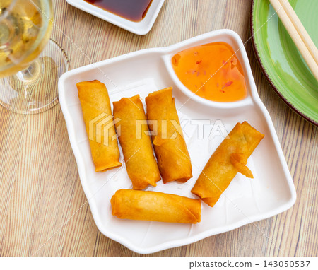 Harumaki Japanese mini rolls with sauce 143050537