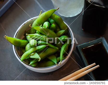 Boiled edamame in a plate top view Boiled edamame in a plate top view 143050791