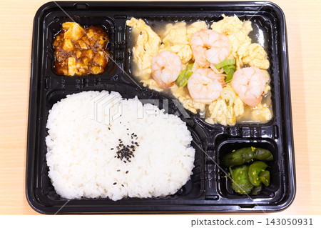 Delicious Chinese bento box with stir-fried shrimp and eggs Delicious Chinese bento box with stir-fried shrimp and eggs 143050931