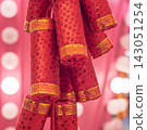 Decorative red firecrackers with shining sequins and gold bands for a vibrant holiday celebration 143051254