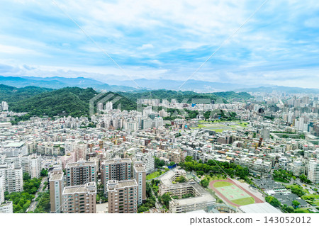 Panoramic aerial view of cityscape, skyline and urban sprawl of Taipei in Taiwan under sun, bright blue sky Panoramic aerial view of cityscape, skyline and urban sprawl of Taipei in Taiwan under sun, bright blue sky 143052012