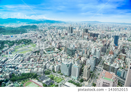 Panoramic aerial view of cityscape, skyline and urban sprawl of Taipei in Taiwan under sun, bright blue sky 143052015