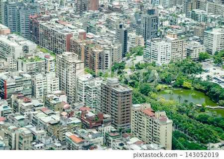 Panoramic aerial view of cityscape, skyline and urban sprawl of Taipei in Taiwan under sun, bright blue sky 143052019