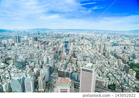 Panoramic aerial view of cityscape, skyline and urban sprawl of Taipei in Taiwan under sun, bright blue sky Panoramic aerial view of cityscape, skyline and urban sprawl of Taipei in Taiwan under sun, bright blue sky 143052022