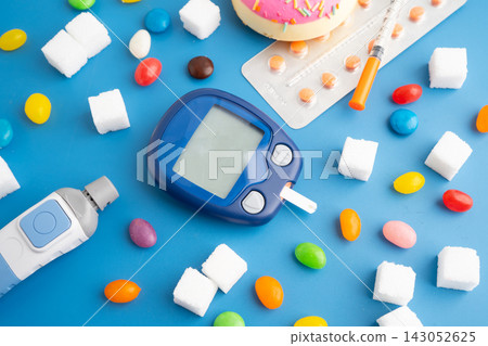 Diabetes digital blood glucose measure with sugar. Diabetes digital blood glucose measure with sugar. 143052625