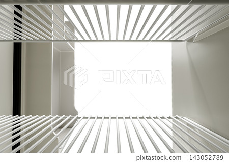 Vew from the inside of refrigerator with an open door Vew from the inside of refrigerator with an open door 143052789